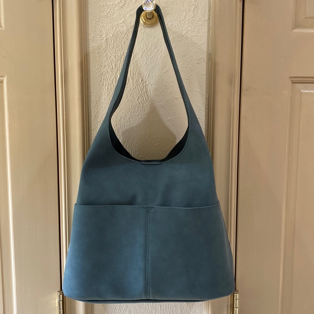 Joy Susan teal green bucket bag with removable pouch and shoulder strap.